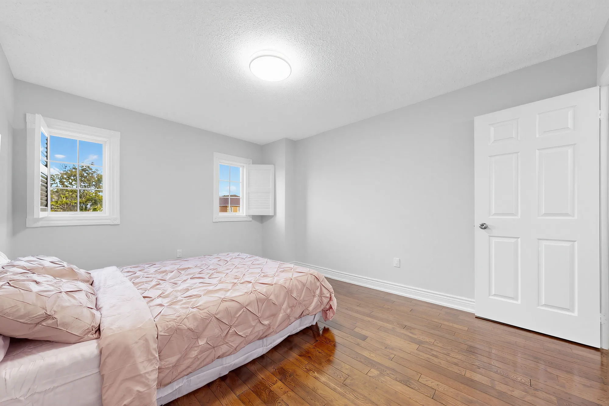 The second front bedroom from the door: the windows, the bed